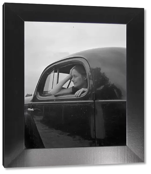 Untitled, 1935-1942. [Woman in a car]. Creator: Unknown