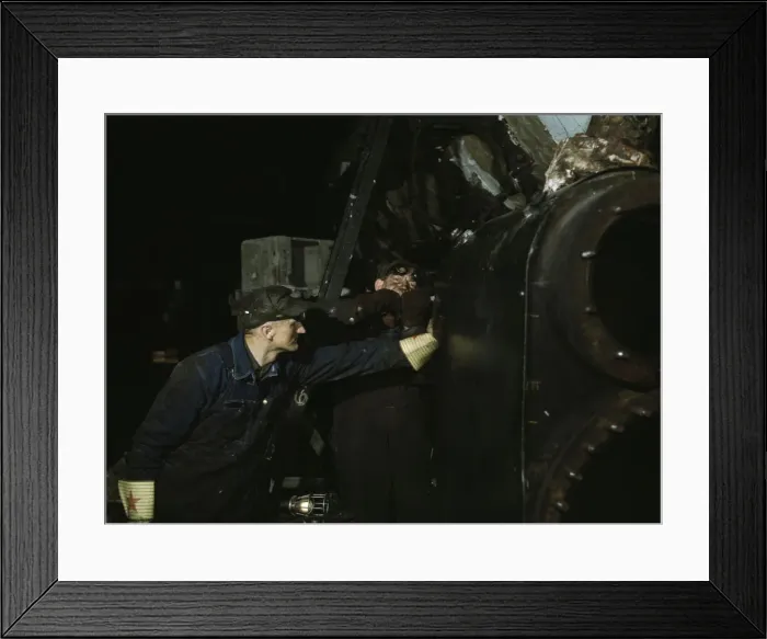 Framed Print : Working on the cylinder of a locomotive at the C & NW RR, 40th Street shops, Chicago, Ill. 1942. Creator: Jack Delano Framed Print : Working on the cylinder of a locomotive at the C & NW RR, 40th Street shops, Chicago, Ill. 1942. Creator: Jack Delano
