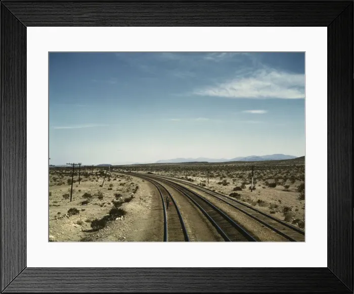 Framed Print : Flagman standing at a distance behind a Santa Fe R.R. west bound freight... Bagdad, Calif. 1943. Creator: Jack Delano