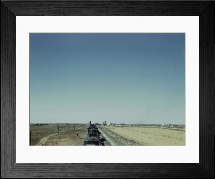 Framed Print : Westbound freight train stopping for water, Melrose, New Mexico, 1943. Creator: Jack Delano Framed Print : Westbound freight train stopping for water, Melrose, New Mexico, 1943. Creator: Jack Delano