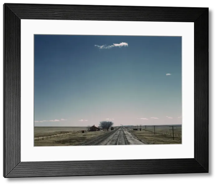 Framed Print : Passing a section house along the Atchison, Topeka, and Santa Fe railroad, New Mexico, 1943. Creator: Jack Delano Framed Print : Passing a section house along the Atchison, Topeka, and Santa Fe railroad, New Mexico, 1943. Creator: Jack Delano