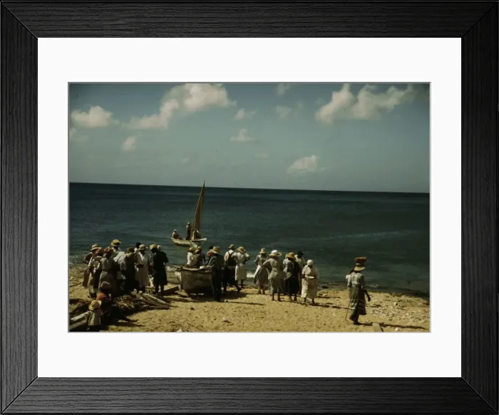 Framed Print : Housewives at the seashore waiting for the fishing boats to come in Frederiksted, V. I. 1941. Creator: Jack Delano Framed Print : Housewives at the seashore waiting for the fishing boats to come in Frederiksted, V. I. 1941. Creator: Jack Delano