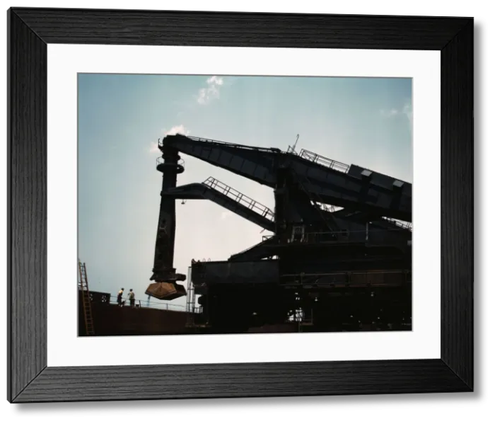 Framed Print : Pennsylvania R.R. ore docks, unloading iron ore from a lake freighter... Cleveland, Ohio, 1943. Creator: Jack Delano Framed Print : Pennsylvania R.R. ore docks, unloading iron ore from a lake freighter... Cleveland, Ohio, 1943. Creator: Jack Delano