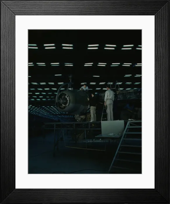 Framed Print : Lowering an engine in place in assembling... Consolidated Aircraft Corp... Fort Worth, Texas, 1942. Creator: Howard Hollem Framed Print : Lowering an engine in place in assembling... Consolidated Aircraft Corp... Fort Worth, Texas, 1942. Creator: Howard Hollem