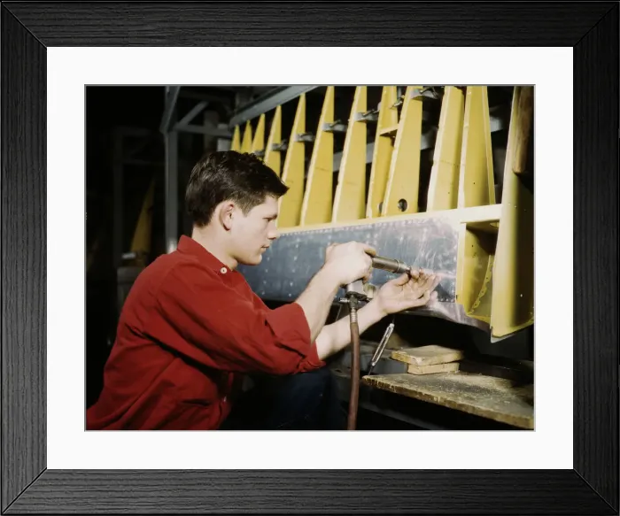 Framed Print : Riveter at work at the Douglas Aircraft Corporation plant in Long Beach, Calif. 1942. Creator: Alfred T Palmer Framed Print : Riveter at work at the Douglas Aircraft Corporation plant in Long Beach, Calif. 1942. Creator: Alfred T Palmer
