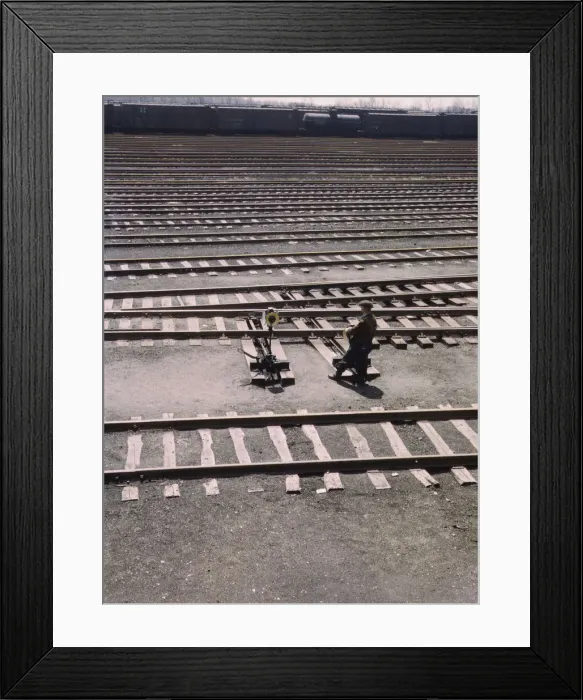 Framed Print : Switchman throwing a switch a C and NW RRs Proviso yard, Chicago, Ill. 1943. Creator: Jack Delano Framed Print : Switchman throwing a switch a C and NW RRs Proviso yard, Chicago, Ill. 1943. Creator: Jack Delano