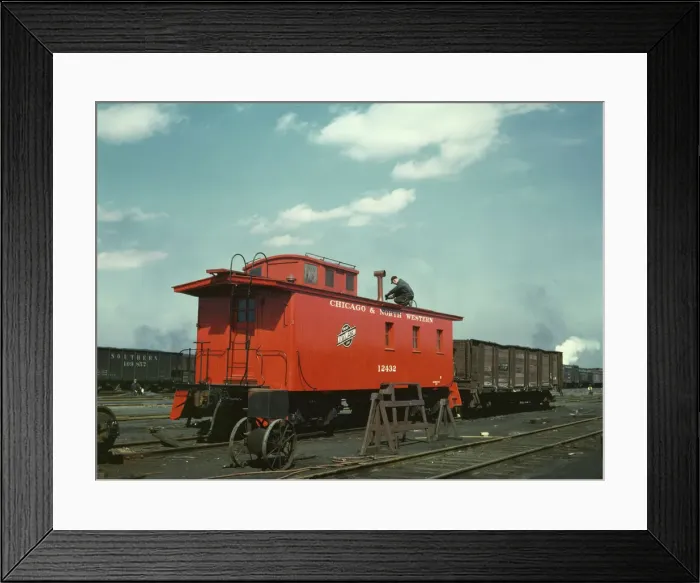 Framed Print : C & NW RR putting the finishing touches on a rebuilt caboose... Proviso yard, Chicago, Ill. 1943. Creator: Jack Delano Framed Print : C & NW RR putting the finishing touches on a rebuilt caboose... Proviso yard, Chicago, Ill. 1943. Creator: Jack Delano