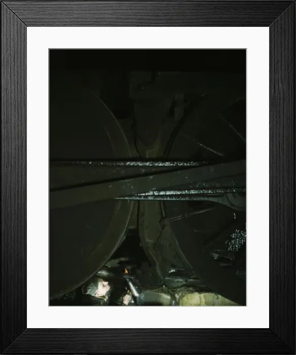 Framed Print : Worker inspecting a locomotive on a pit in the round... C & NW RRs Proviso yard, Chicago, Ill. 1942 Creator: Jack Delano Framed Print : Worker inspecting a locomotive on a pit in the round... C & NW RRs Proviso yard, Chicago, Ill. 1942 Creator: Jack Delano