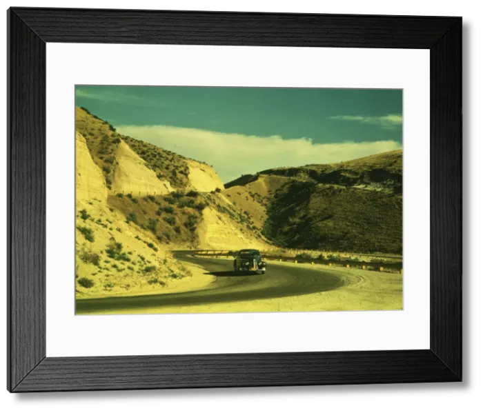 Framed Print : Road cut into the barren hills which lead into Emmett, Idaho, 1941. Creator: Russell Lee Framed Print : Road cut into the barren hills which lead into Emmett, Idaho, 1941. Creator: Russell Lee