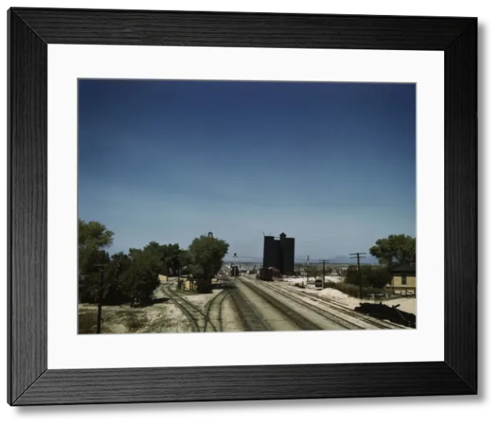 Framed Print : Santa Fe R. R. going through Yucca, Arizona; a watering and refueling stop, 1943. Creator: Jack Delano Framed Print : Santa Fe R. R. going through Yucca, Arizona; a watering and refueling stop, 1943. Creator: Jack Delano
