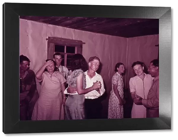 Scene at square dance in rural home in McIntosh County, Oklahoma, 1939 or 1940. Creator: Russell Lee