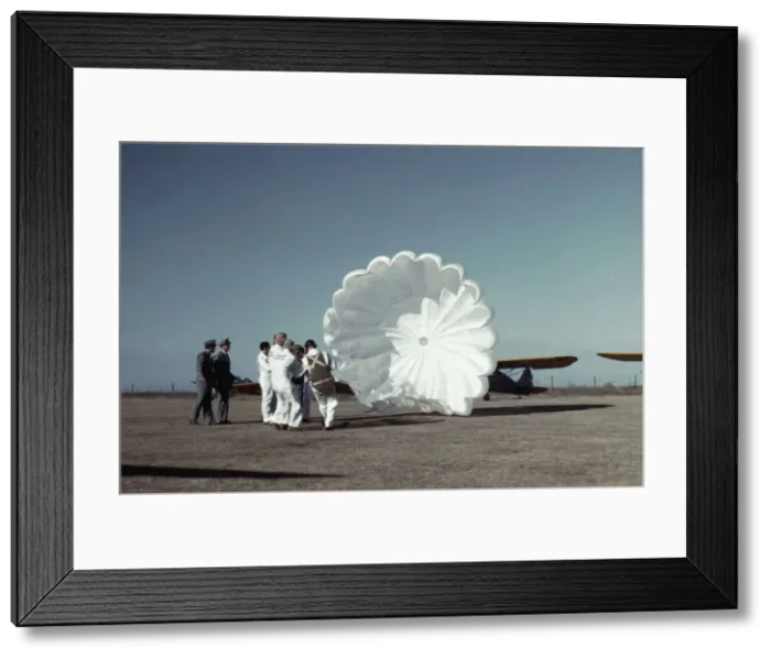 Framed Print : Instructor explaining the operation of a parachute to student pilots, Fort Worth, Tex. 1942. Creator: Arthur Rothstein Framed Print : Instructor explaining the operation of a parachute to student pilots, Fort Worth, Tex. 1942. Creator: Arthur Rothstein