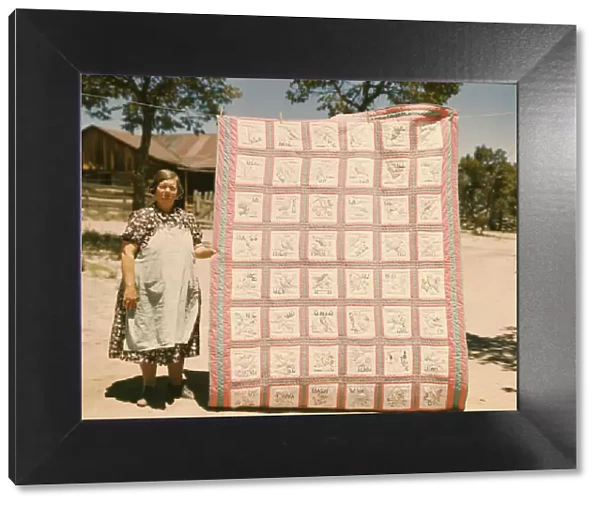 Mrs. Bill Stagg with state quilt that she made, Pie Town, New Mexico. 1940. Creator: Russell Lee