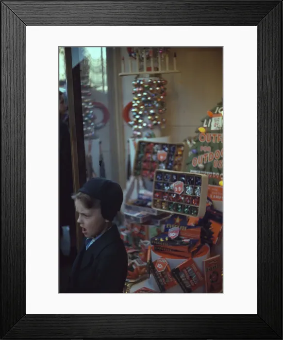 Framed Print : Boy beside store window display of Christmas ornaments, between 1941 and 1942. Creator: Unknown Framed Print : Boy beside store window display of Christmas ornaments, between 1941 and 1942. Creator: Unknown
