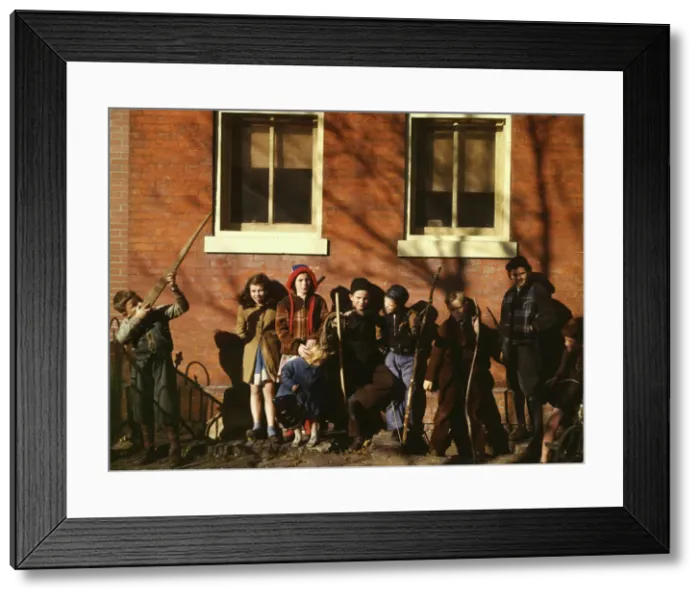 Framed Print : Children aiming sticks as guns, lined up against a brick building, Washington, D. C. ?, 1941-1942. Creator: Unknown Framed Print : Children aiming sticks as guns, lined up against a brick building, Washington, D. C. ?, 1941-1942. Creator: Unknown