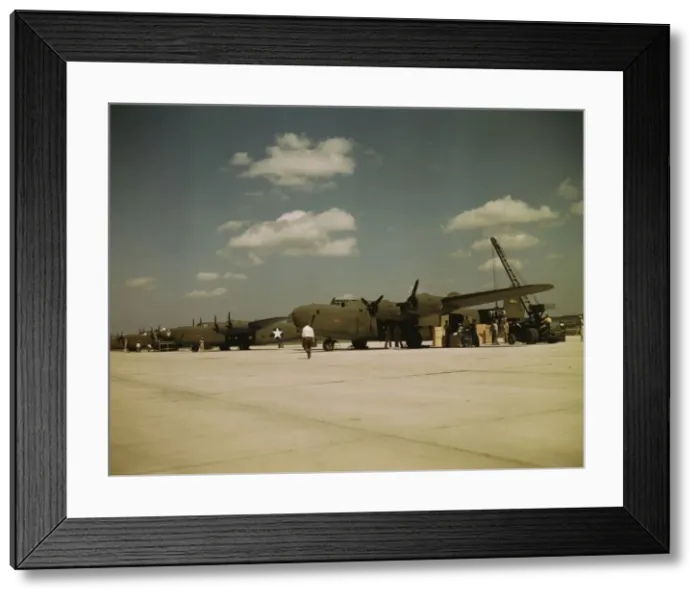 Framed Print : Loading new transport planes at the Consolidated Aircraft Corporation plant, Fort Worth, Texas, 1942 Creator: Howard Hollem Framed Print : Loading new transport planes at the Consolidated Aircraft Corporation plant, Fort Worth, Texas, 1942 Creator: Howard Hollem