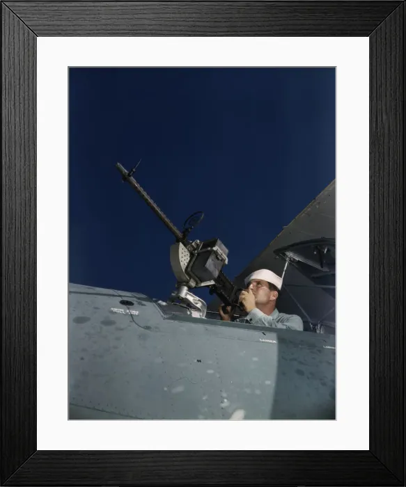 Framed Print : Hes like to use that gun on the Axis, Naval Air Base, Corpus Christi, Texas, 1942. Creator: Howard Hollem Framed Print : Hes like to use that gun on the Axis, Naval Air Base, Corpus Christi, Texas, 1942. Creator: Howard Hollem