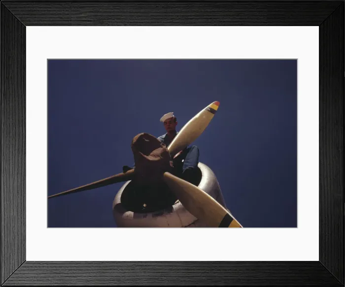 Framed Print : This sailor mechanic is inspecting a PBY plane at the Naval Air Base in Corpus Christi, Texas, 1942. Creator: Howard Hollem Framed Print : This sailor mechanic is inspecting a PBY plane at the Naval Air Base in Corpus Christi, Texas, 1942. Creator: Howard Hollem