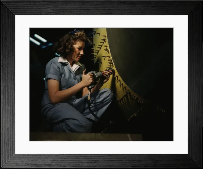 Framed Print : Riveter at work on Consolidated bomber, Consolidated Aircraft Corp. Fort Worth, Texas, 1942. Creator: Howard Hollem Framed Print : Riveter at work on Consolidated bomber, Consolidated Aircraft Corp. Fort Worth, Texas, 1942. Creator: Howard Hollem