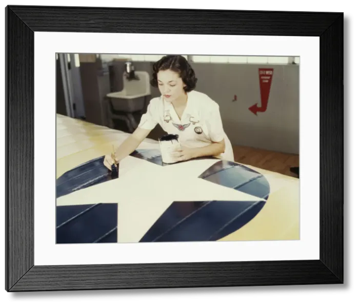 Framed Print : Painting the American insignia on airplane wings is a job that Mrs... Corpus Christi, Texas, 1942. Creator: Howard Hollem Framed Print : Painting the American insignia on airplane wings is a job that Mrs... Corpus Christi, Texas, 1942. Creator: Howard Hollem