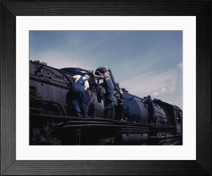 Framed Print : C. & N.W. R.R. women wipers employed at the roundhouse cleaning one of the... Clinton, Iowa, 1943. Creator: Jack Delano Framed Print : C. & N.W. R.R. women wipers employed at the roundhouse cleaning one of the... Clinton, Iowa, 1943. Creator: Jack Delano
