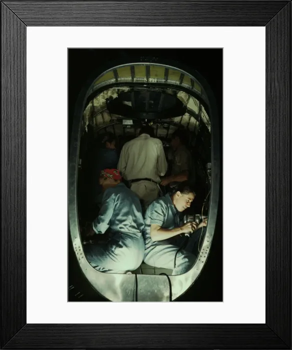 Framed Print : Working inside fuselage of a Liberator Bomber, Consolidated Aircraft Corp. Fort Worth, Texas, 1942. Creator: Howard Hollem Framed Print : Working inside fuselage of a Liberator Bomber, Consolidated Aircraft Corp. Fort Worth, Texas, 1942. Creator: Howard Hollem