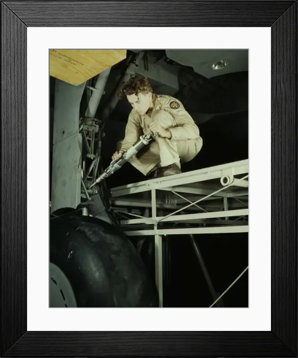 Framed Print : A hydraulic mechanic greasing the landing gear of a transport... Fort Worth, Texas, 1942. Creator: Howard Hollem Framed Print : A hydraulic mechanic greasing the landing gear of a transport... Fort Worth, Texas, 1942. Creator: Howard Hollem