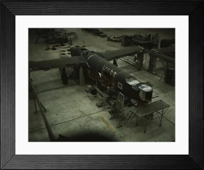 Framed Print : A mating operation on a transport plane... Consolidated Aircraft Corp... Fort Worth, Texas, 1942. Creator: Howard Hollem Framed Print : A mating operation on a transport plane... Consolidated Aircraft Corp... Fort Worth, Texas, 1942. Creator: Howard Hollem