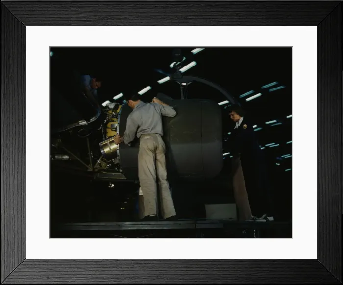Framed Print : Lowering an engine in place in assembling a C-87... Consolidated Aircraft... Fort Worth, Texas, 1942 Creator: Howard Hollem Framed Print : Lowering an engine in place in assembling a C-87... Consolidated Aircraft... Fort Worth, Texas, 1942 Creator: Howard Hollem