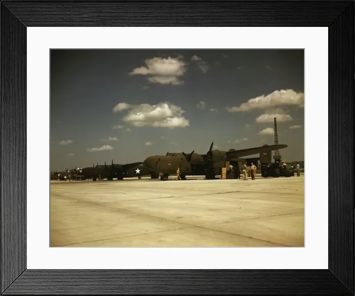 Framed Print : Consolidated transport planes being loaded, Consolidated Aircraft Corp. Fort Worth, Texas, 1942. Creator: Howard Hollem Framed Print : Consolidated transport planes being loaded, Consolidated Aircraft Corp. Fort Worth, Texas, 1942. Creator: Howard Hollem