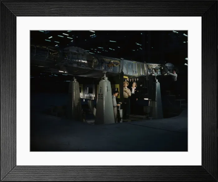 Framed Print : Working on the wing center section at the Consolidated Aircraft Corp... Fort Worth, Texas, 1942. Creator: Howard Hollem Framed Print : Working on the wing center section at the Consolidated Aircraft Corp... Fort Worth, Texas, 1942. Creator: Howard Hollem