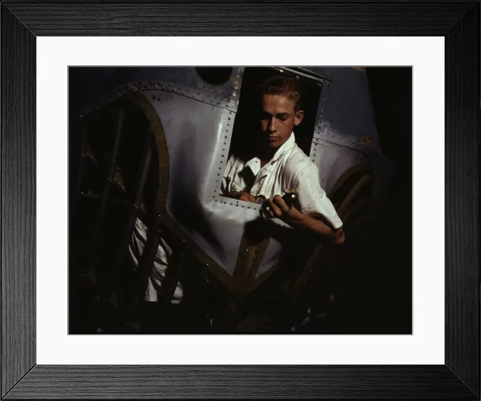 Framed Print : Working inside the nose of a PBY, Elmer J. Pace is learning the... Corus Christi, Texas, 1942. Creator: Howard Hollem Framed Print : Working inside the nose of a PBY, Elmer J. Pace is learning the... Corus Christi, Texas, 1942. Creator: Howard Hollem