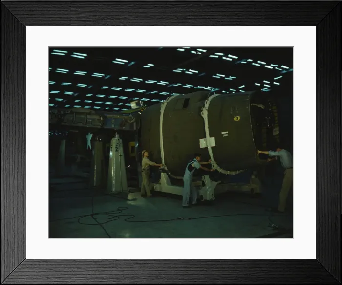 Framed Print : Putting the nose section of a mighty transport... Consolidated Aircraft... Fort Worth, Texas, 1942. Creator: Howard Hollem Framed Print : Putting the nose section of a mighty transport... Consolidated Aircraft... Fort Worth, Texas, 1942. Creator: Howard Hollem
