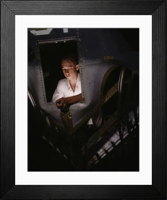 Framed Print : As an NYA trainee working inside the nose of a PBY, Elmer J. Pace... Corpus Christi, Texas, 1942. Creator: Howard Hollem Framed Print : As an NYA trainee working inside the nose of a PBY, Elmer J. Pace... Corpus Christi, Texas, 1942. Creator: Howard Hollem