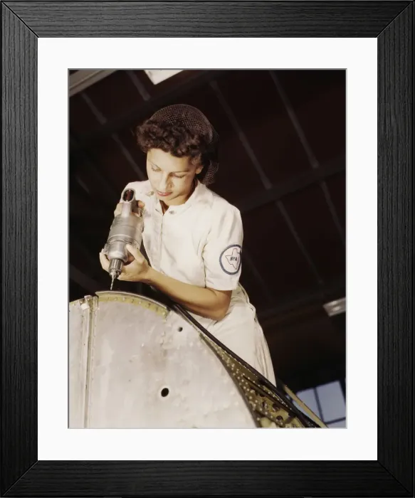 Framed Print : A rivet is her fighting weapon... Naval Air Base, Corpus Christi, Texas, 1942. Creator: Howard Hollem Framed Print : A rivet is her fighting weapon... Naval Air Base, Corpus Christi, Texas, 1942. Creator: Howard Hollem