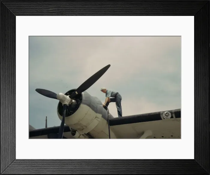 Framed Print : Sailor mechanic fueling a plane at the Naval Air Base, Corpus Christi, Texas, 1942. Creator: Howard Hollem Framed Print : Sailor mechanic fueling a plane at the Naval Air Base, Corpus Christi, Texas, 1942. Creator: Howard Hollem