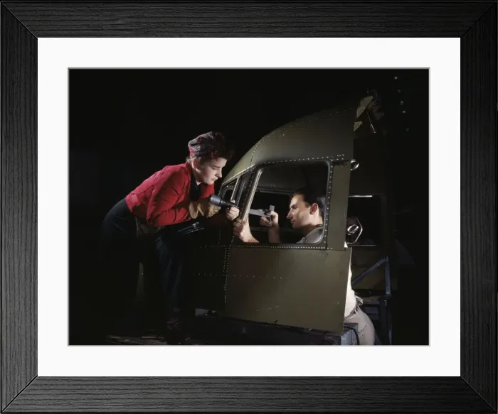 Framed Print : Riveting team working on the cockpit shell of a... Douglas Aircraft Co. Long Beach, Calif. 1942. Creator: Alfred T Palmer Framed Print : Riveting team working on the cockpit shell of a... Douglas Aircraft Co. Long Beach, Calif. 1942. Creator: Alfred T Palmer