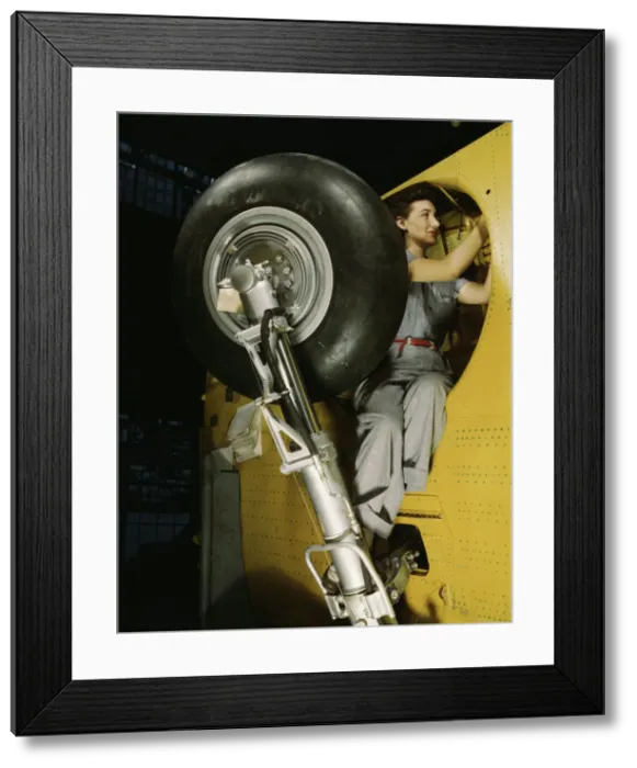 Framed Print : This woman worker at the Vultee-Nashville is shown making... Nashville, Tenn. 1943. Creator: Alfred T Palmer Framed Print : This woman worker at the Vultee-Nashville is shown making... Nashville, Tenn. 1943. Creator: Alfred T Palmer