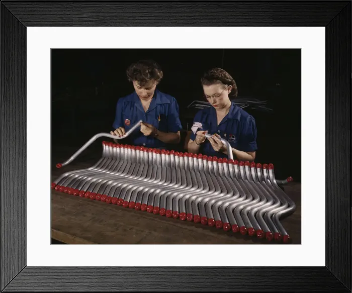 Framed Print : Two women workers are shown capping and inspecting tubing... Vultees Nashville... Tennessee, 1943. Creator: Alfred T Palmer