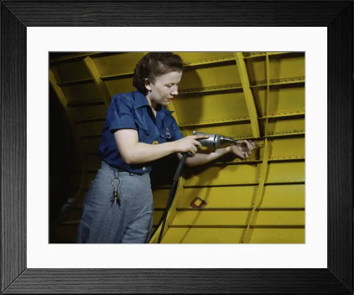 Framed Print : Operating a hand drill at Vultee-Nashville, woman is working on a Vengeance'dive... Tenn. 1943. Creator: Alfred T Palmer Framed Print : Operating a hand drill at Vultee-Nashville, woman is working on a Vengeance'dive... Tenn. 1943. Creator: Alfred T Palmer