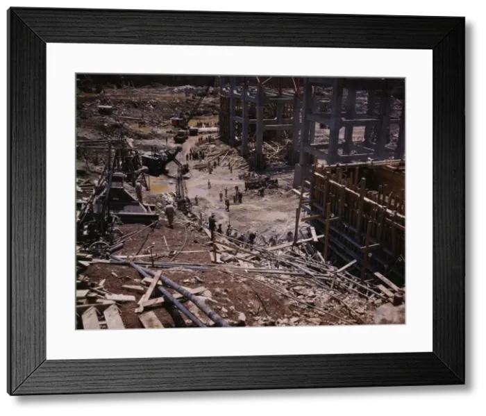 Framed Print : Excavating within the log cofferdam during an early stage of construction, Douglas Dam, Tenn. 1942. Creator: Alfred T Palmer Framed Print : Excavating within the log cofferdam during an early stage of construction, Douglas Dam, Tenn. 1942. Creator: Alfred T Palmer