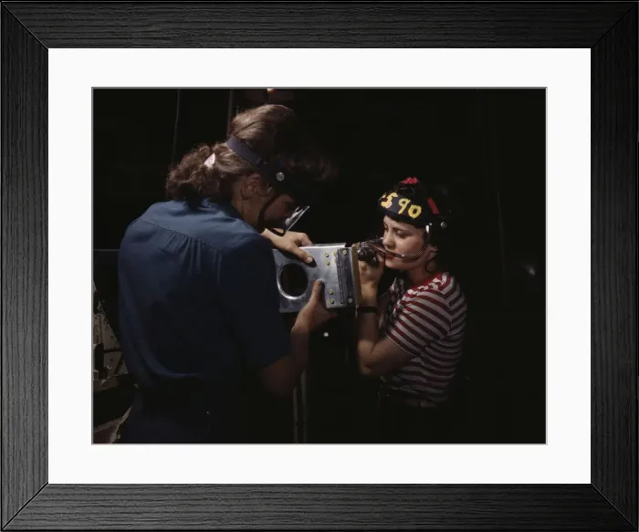 Framed Print : Two women employees of North American Aviation, Incorporated, assembling a section of a... 1942. Creator: Alfred T Palmer Framed Print : Two women employees of North American Aviation, Incorporated, assembling a section of a... 1942. Creator: Alfred T Palmer