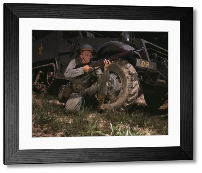 Framed Print : Infantryman with halftrack, a young soldier of the armed forces, holds... Fort Knox, Ky. 1942. Creator: Alfred T Palmer