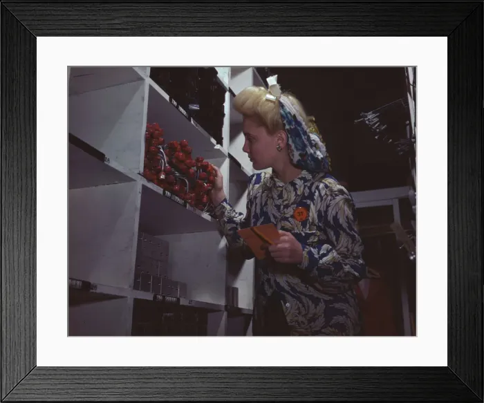 Framed Print : Clerk in one of the stock rooms of North American Aviation, Inc... Inglewood, Calif. 1942. Creator: Alfred T Palmer Framed Print : Clerk in one of the stock rooms of North American Aviation, Inc... Inglewood, Calif. 1942. Creator: Alfred T Palmer