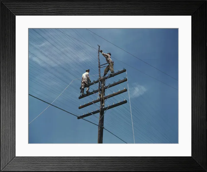 Framed Print : Men working on telephone lines, probably near a TVA dam hydroelectric plant, 1942. Creator: Alfred T Palmer Framed Print : Men working on telephone lines, probably near a TVA dam hydroelectric plant, 1942. Creator: Alfred T Palmer
