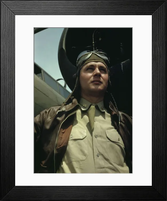 Framed Print : U.S. Army Air Forces pilot in front of a YB-17 bombing... probably Langley field, Virginia, 1942. Creator: Alfred T Palmer Framed Print : U.S. Army Air Forces pilot in front of a YB-17 bombing... probably Langley field, Virginia, 1942. Creator: Alfred T Palmer