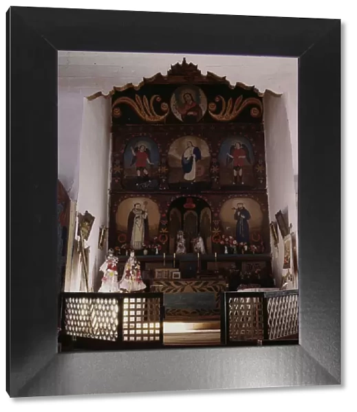 The main altar in the church, Trampas, N. M. 1943. Creator: John Collier