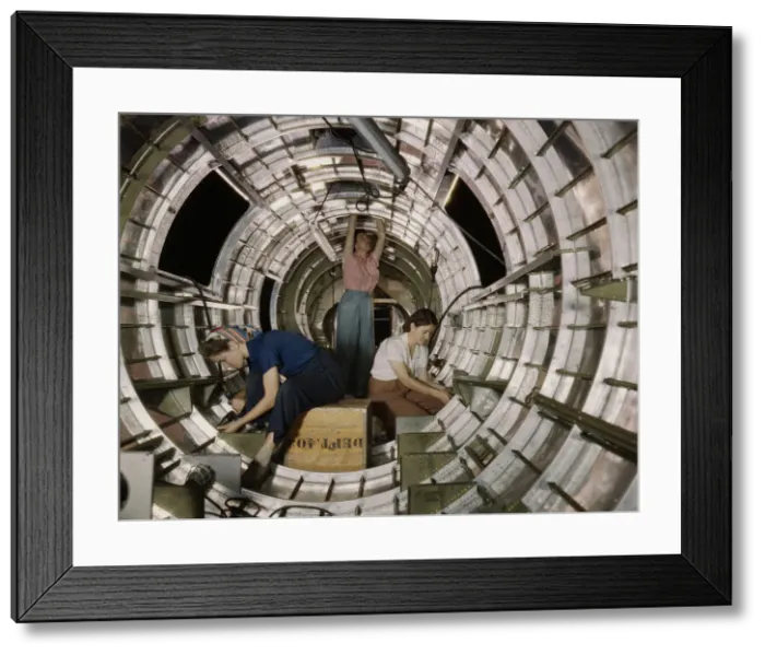 Framed Print : Women workers install fixtures and assemblies... Douglas Aircraft Company, Long Beach, Calif. 1942. Creator: Alfred T Palmer Framed Print : Women workers install fixtures and assemblies... Douglas Aircraft Company, Long Beach, Calif. 1942. Creator: Alfred T Palmer