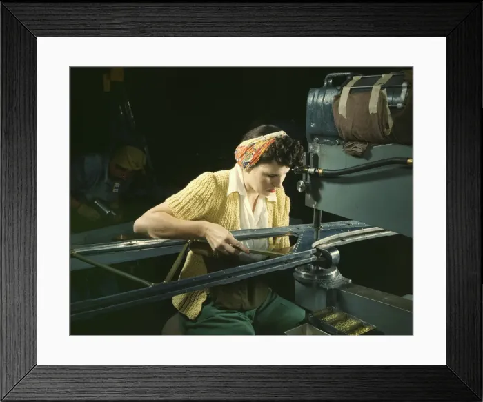 Framed Print : A girl riveting machine operator at the Douglas Aircraft Company plant... Long Beach, Calif. 1942 Creator: Alfred T Palmer Framed Print : A girl riveting machine operator at the Douglas Aircraft Company plant... Long Beach, Calif. 1942 Creator: Alfred T Palmer