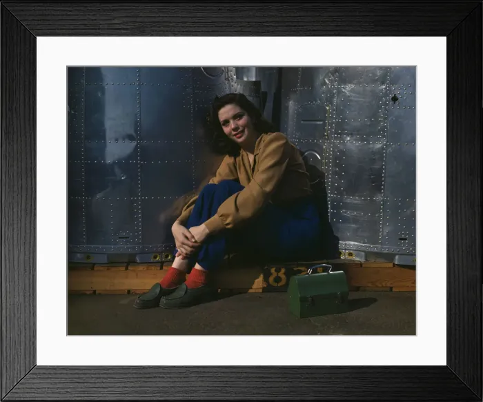 Framed Print : A noontime rest for a full-fledged assembly worker... Long Beach, Calif. Plant of Douglas... 1942. Creator: Alfred T Palmer Framed Print : A noontime rest for a full-fledged assembly worker... Long Beach, Calif. Plant of Douglas... 1942. Creator: Alfred T Palmer